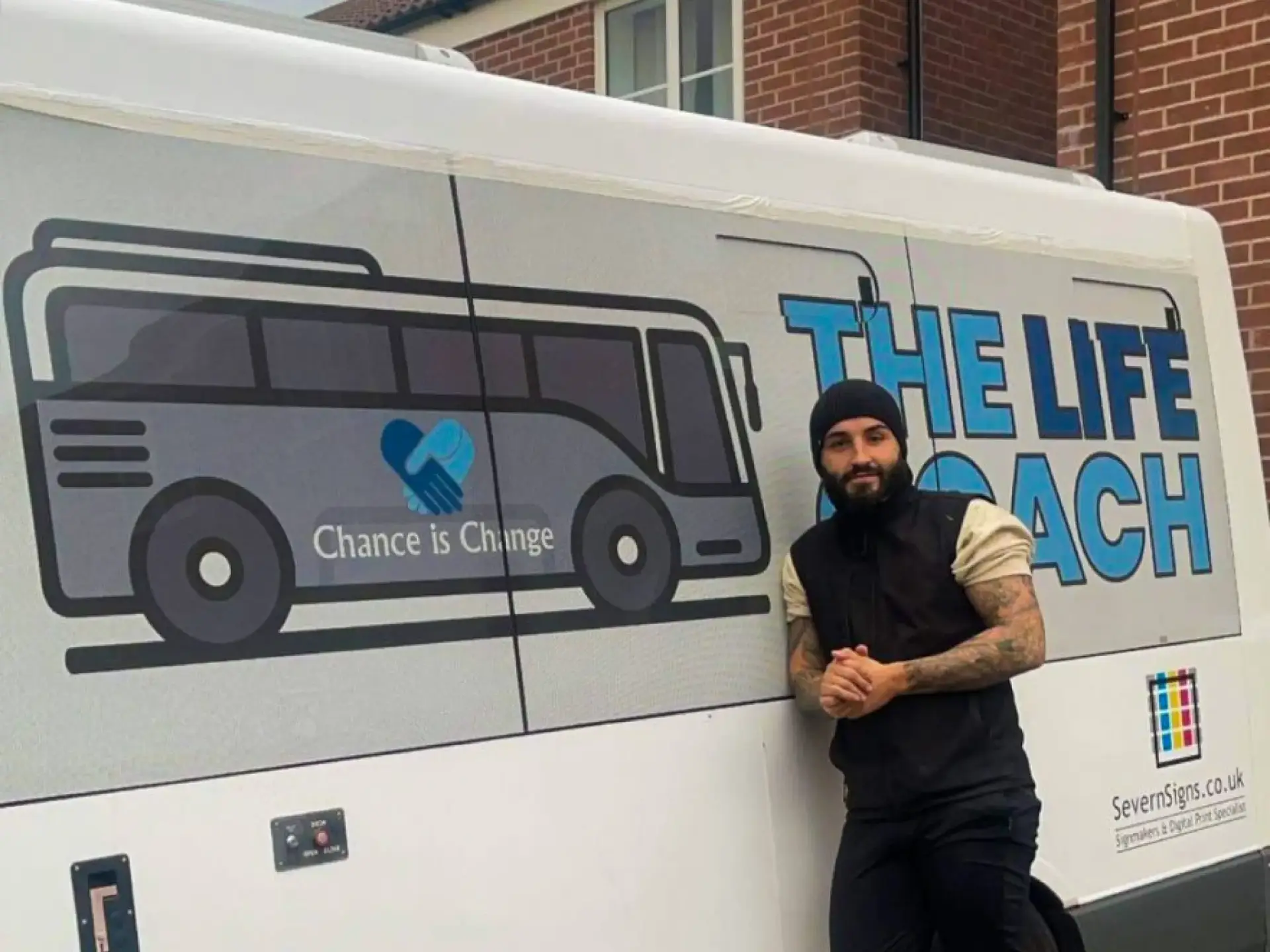 Tom Hoskins outside of The Life Coach, the mobile safe space in Gloucestershire.